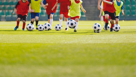 Children playing football sport.jpg